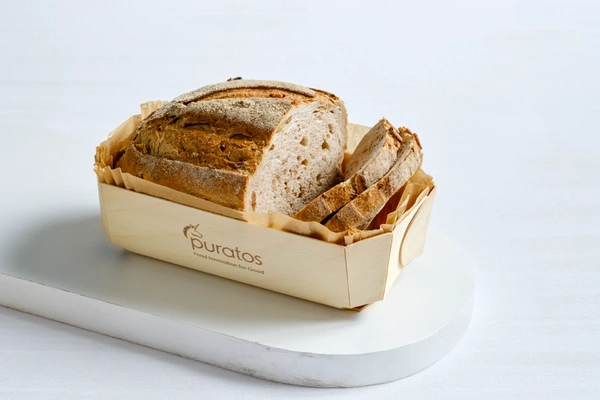 Image pulse based sourdough bread on paper tray on white board