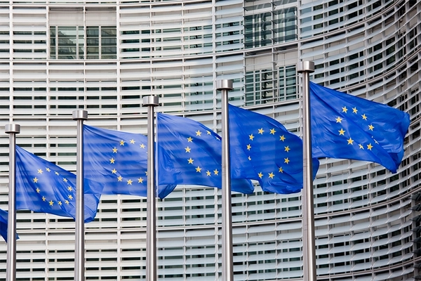 European Commission building and flags.