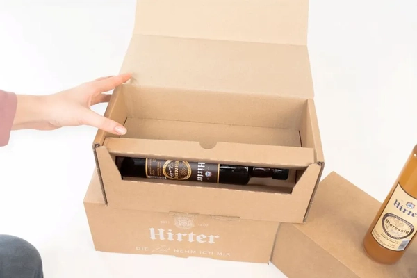 cardboard box with glass bottle inside