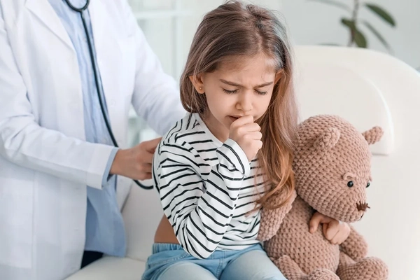 Young child girl coughing