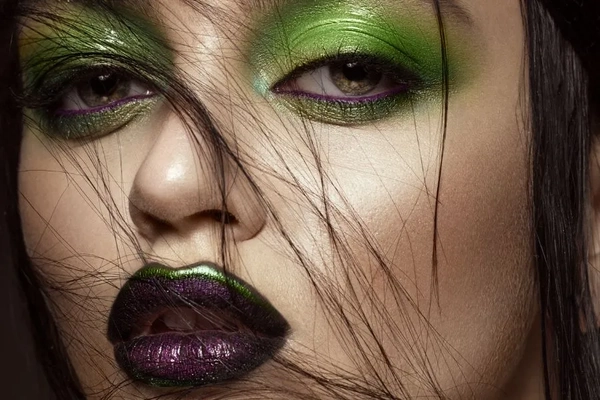 Image Woman with green styled makeup