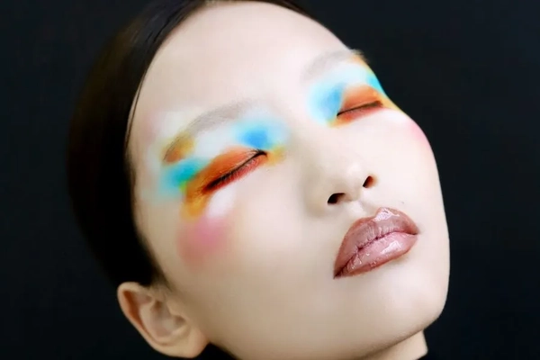 Image Woman with pale face and color makeup
