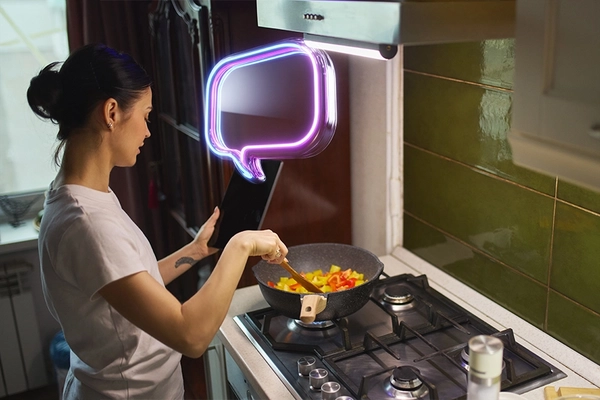 AI powered digital assistant displayed on tablet held by woman cooking in modern kitchen