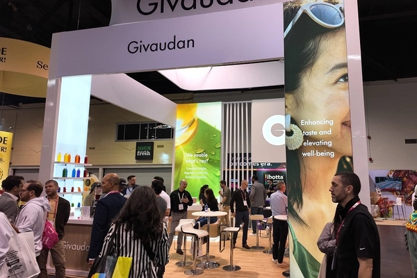 crowd of people outside Givaudan booth at a trade show