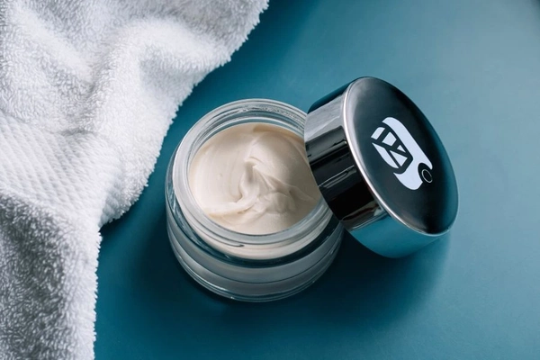 Cream in glass jar.