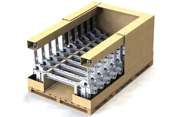 A cardboard box with metal parts inside