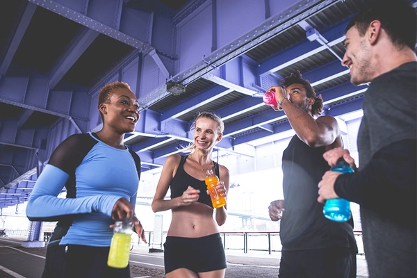 Runners in New York drinking sports beverages.
