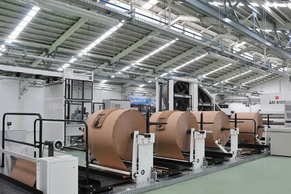 Image A large roll of paper in a factory