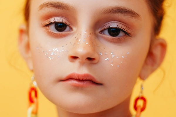 Sephora kids skincare rules little girl with glitter on face looks unhappily at camera