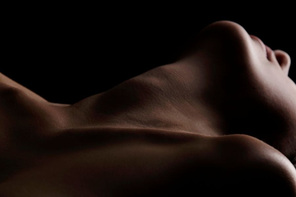 Image closeup of persons neck and collarbone