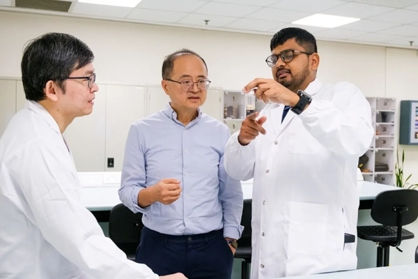 Image A group of men in lab coats