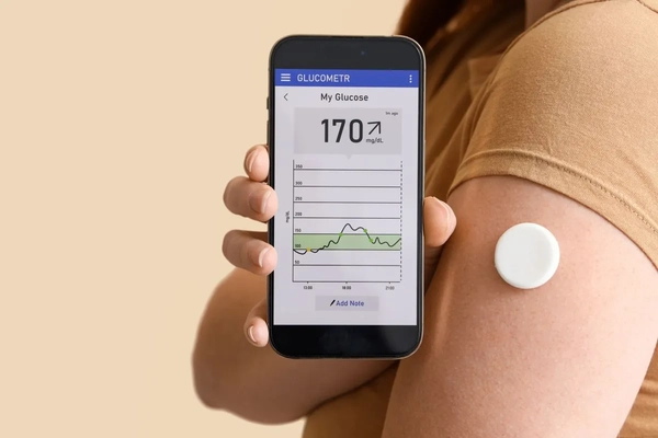 Image woman checking blood glucose levels