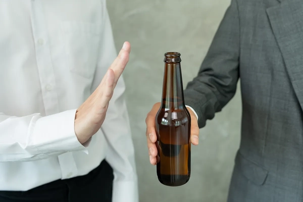 man rejects offer of beer bottle
