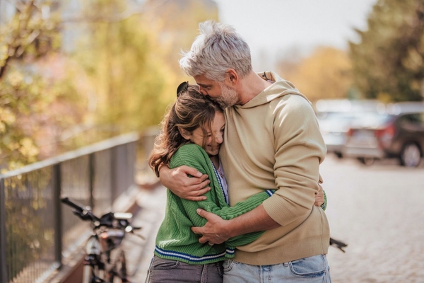father and daughter hug