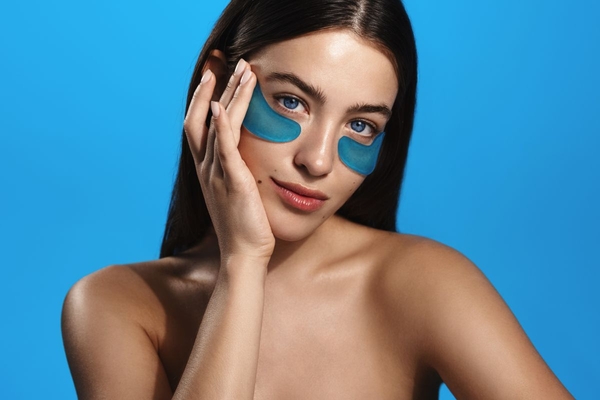 woman with blue silicone eye masks on