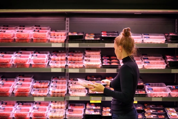 Image Woman buying meat in the supermarket