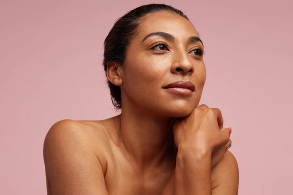 Image Woman against a pink background