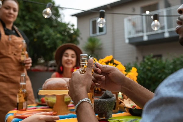 Image man opens glass bottle with opener