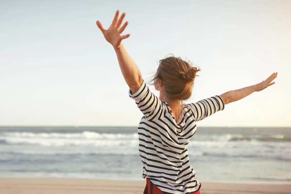 Image Happy woman on the beach
