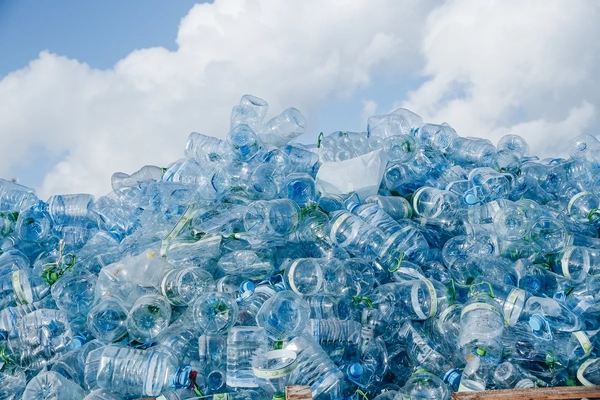 A stack of water bottles in a landfill. A stack of water bottles in a landfill.