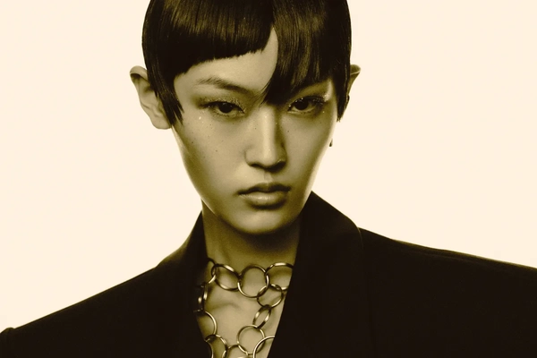 A model in black and white staring into the camera.