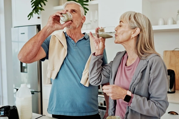 Elderly couple drinking nutritional shake Elderly couple drinking nutritional shake