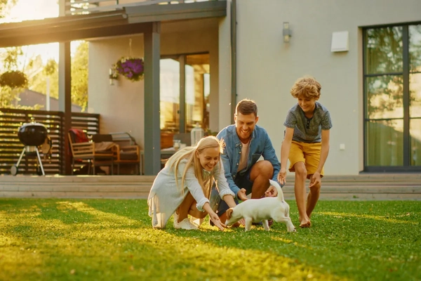 Family playing with dog