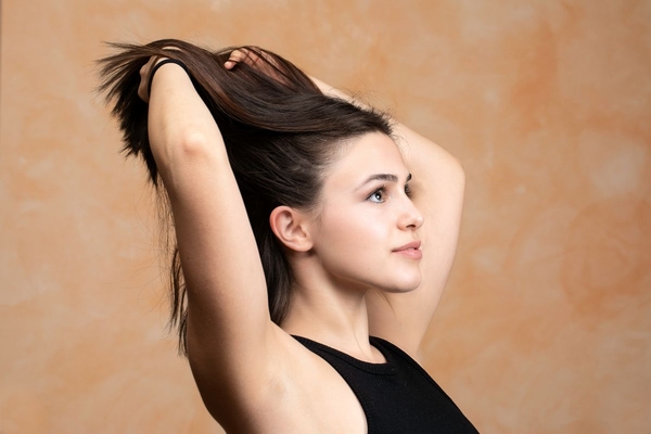 woman tosses hair