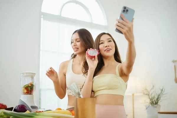 Wellness influencers posing with food Wellness influencers posing with food