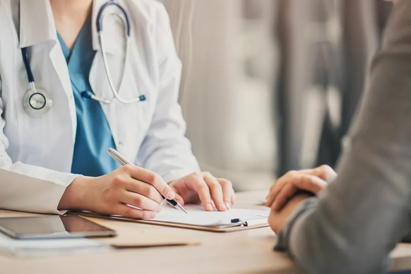 Image Doctor and patient talking