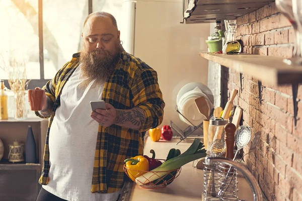 Image Man checking phone