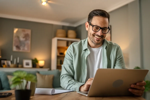 Image Man working behind a computer