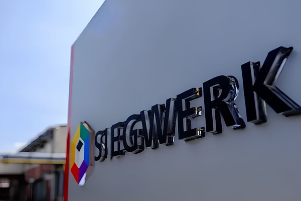 A logo of a company on a wall
