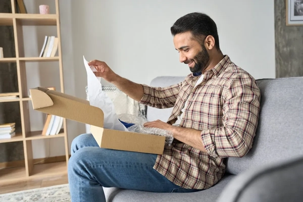 A man opening a box