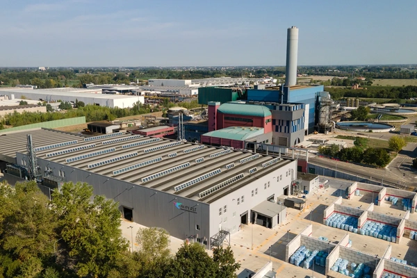 birds-eye shot recycling facility against blue sky