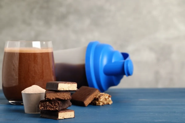 protein bar and drink in glass
